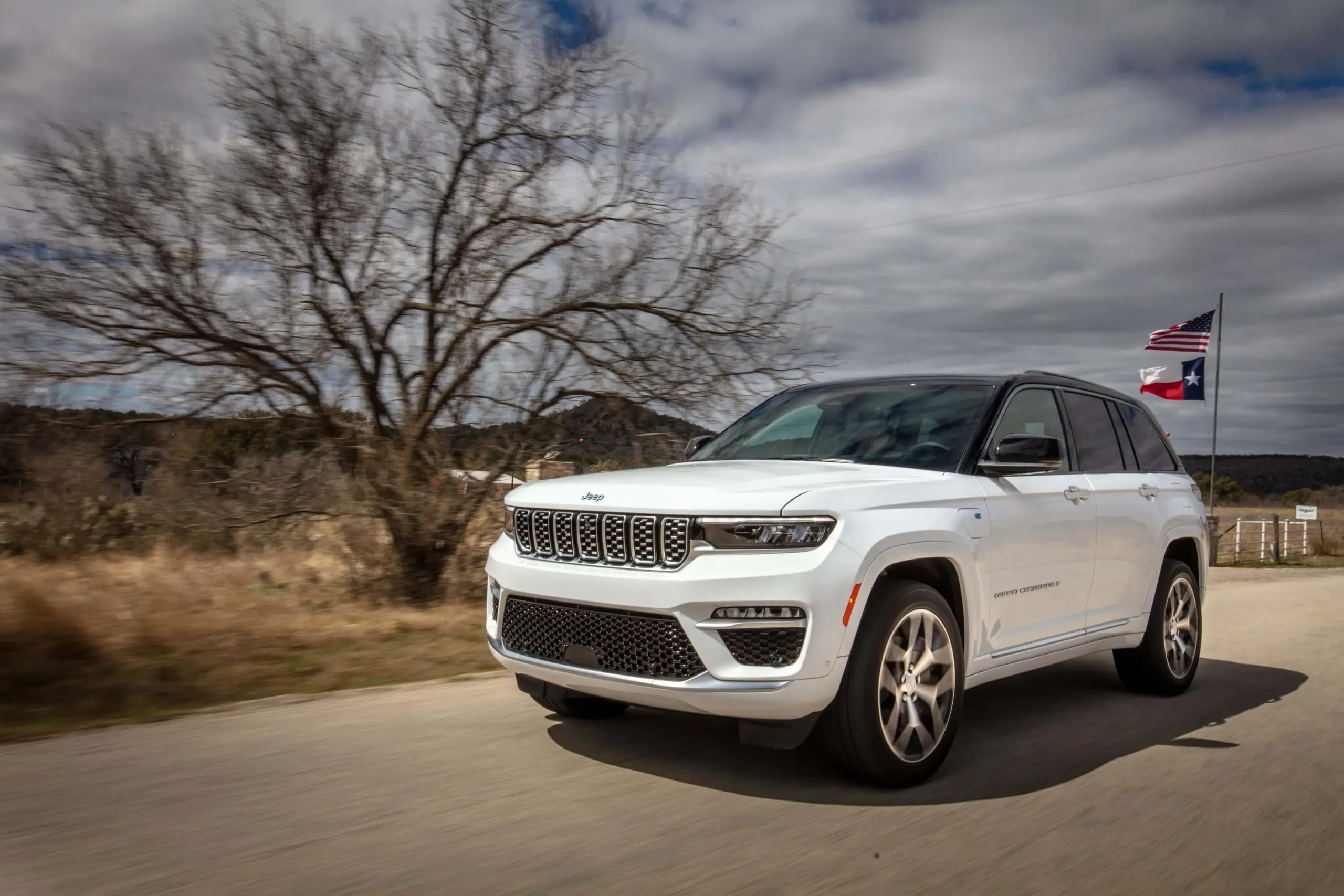 A Jeep Grand Cherokee 4xe driving down a road near Exeter, CA. 